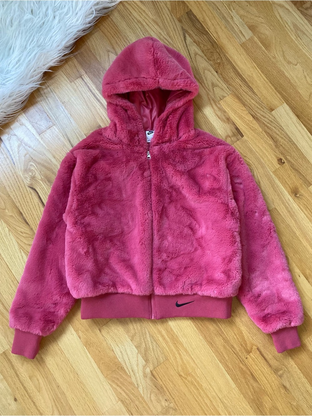 Nike Essential Faux Fur Plush Hooded Zip Bomber Jacket in Rose Pink